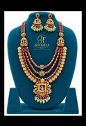Premium Multilayered Lakshmi Temple Jewellery Necklace Set With Matching Jhumkas, Ruby-Red stones, and Green Beads